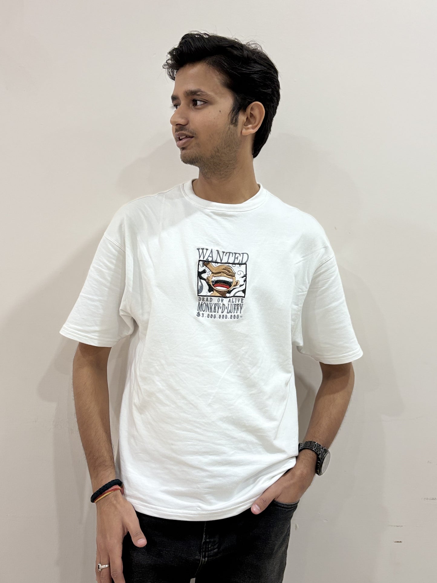 White oversized t-shirt with premium One Piece Luffy embroidery – Drip Saga anime streetwear.