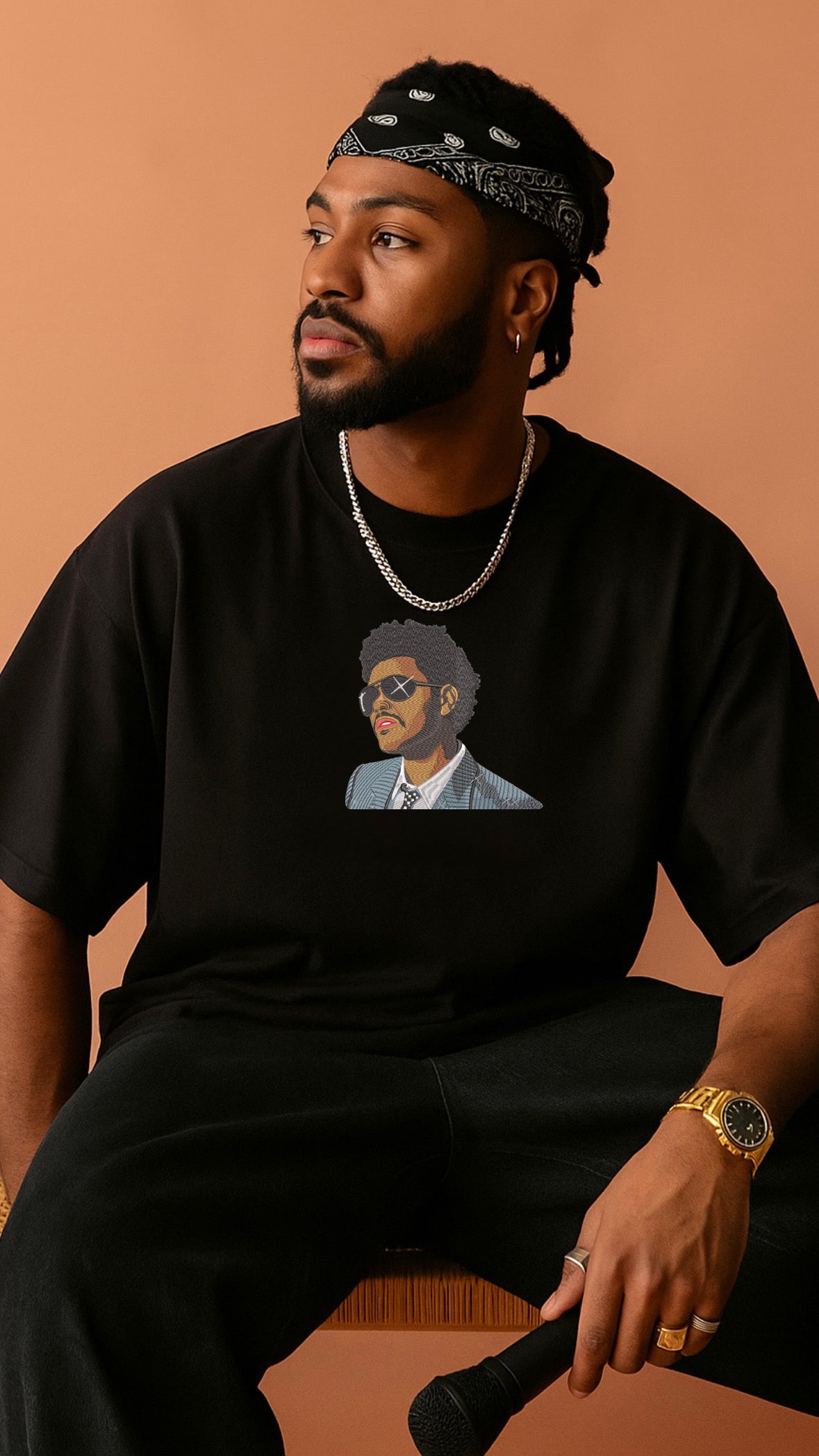 Model wearing black oversized t-shirt with The Weeknd embroidered design – DripSaga