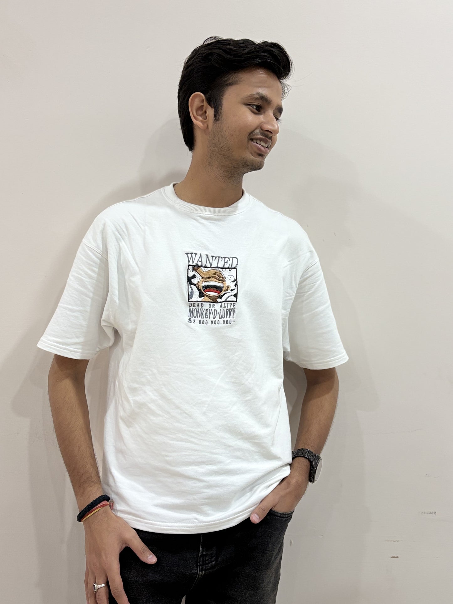 White oversized t-shirt with premium One Piece Luffy embroidery – Drip Saga anime streetwear.