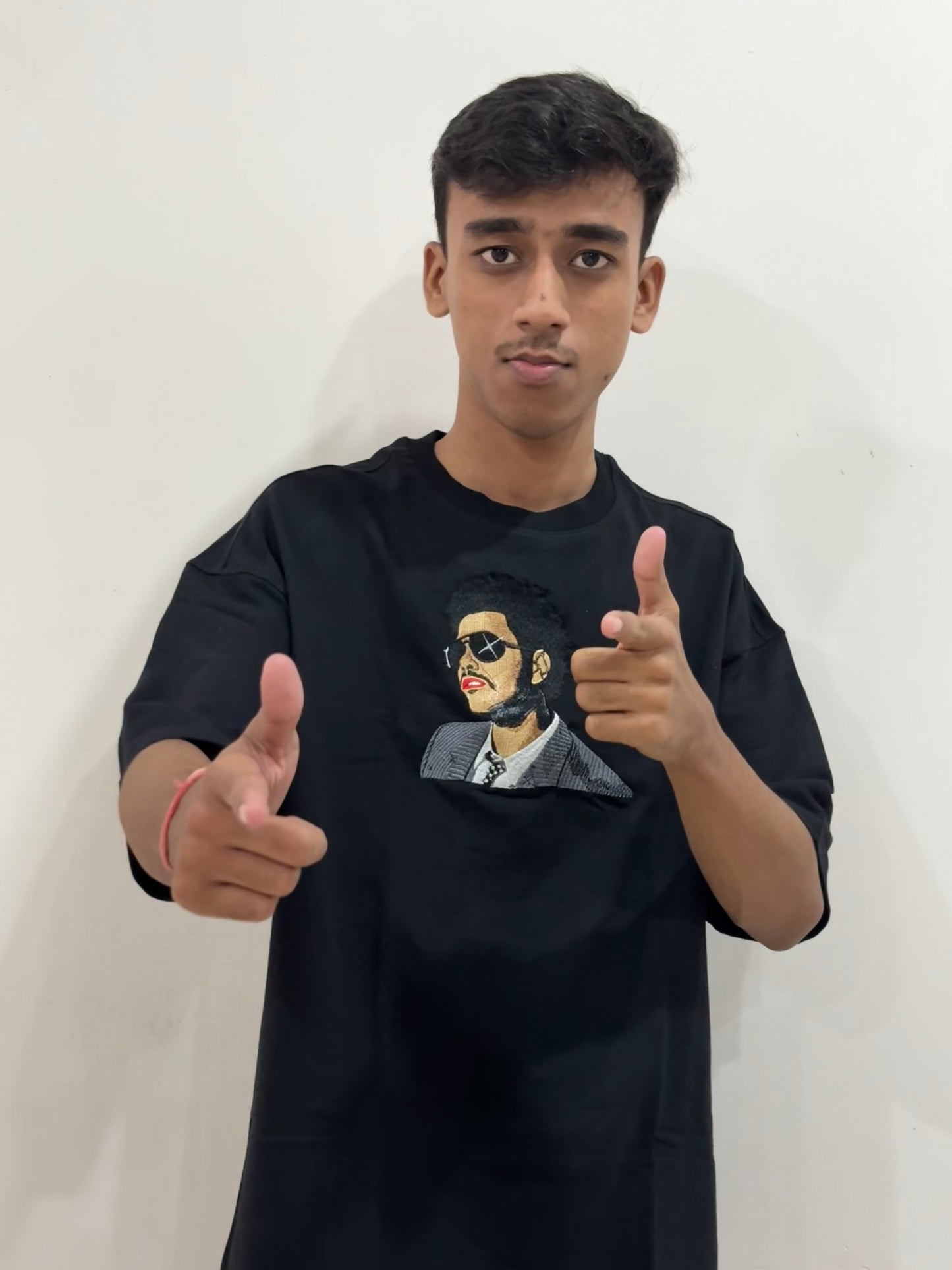Black oversized t-shirt with premium The Weeknd embroidered design – Drip Saga luxury streetwear.