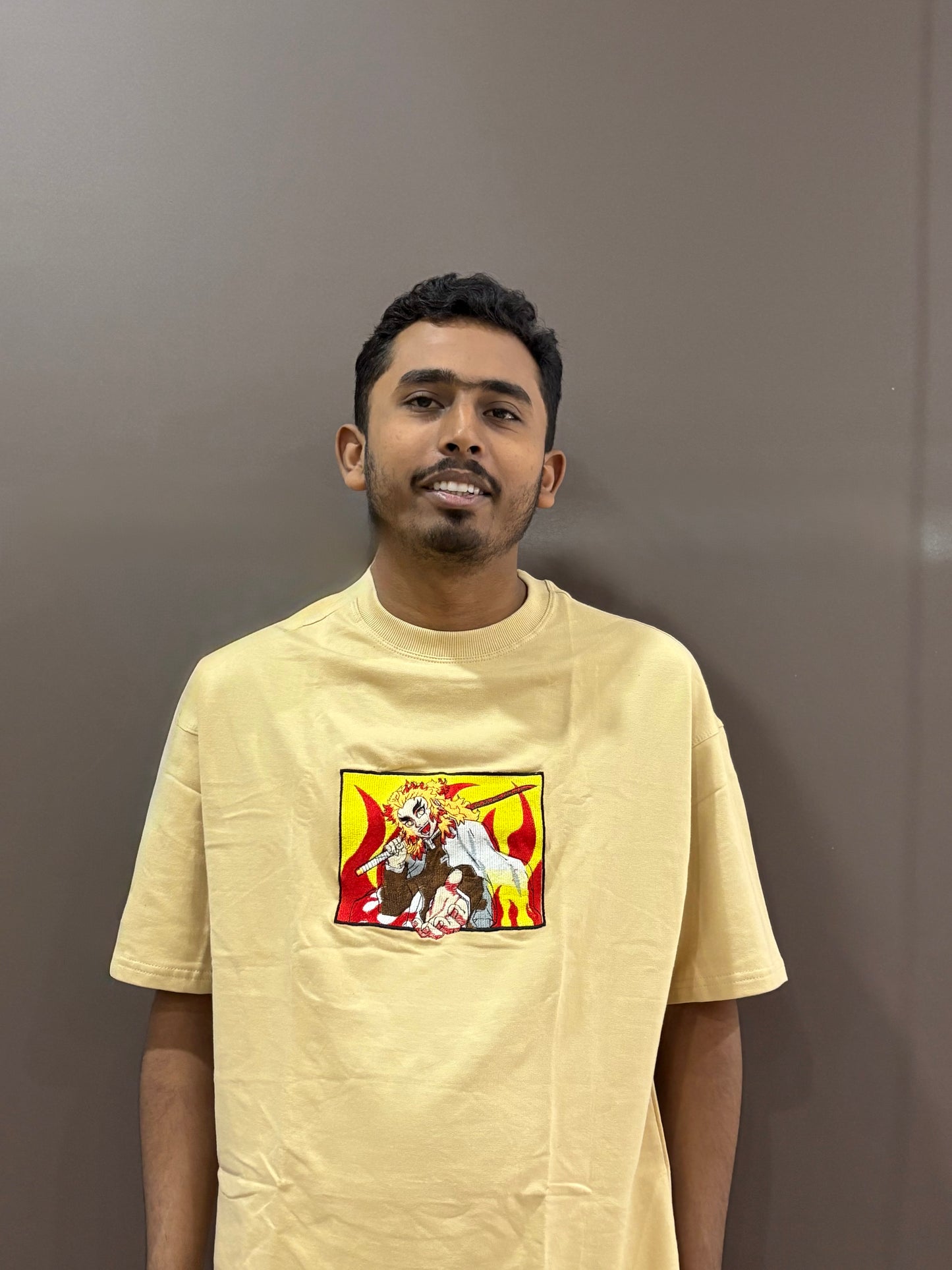 Beige oversized t-shirt with premium Demon Slayer Kyojuro Rengoku embroidery – Drip Saga anime fashion