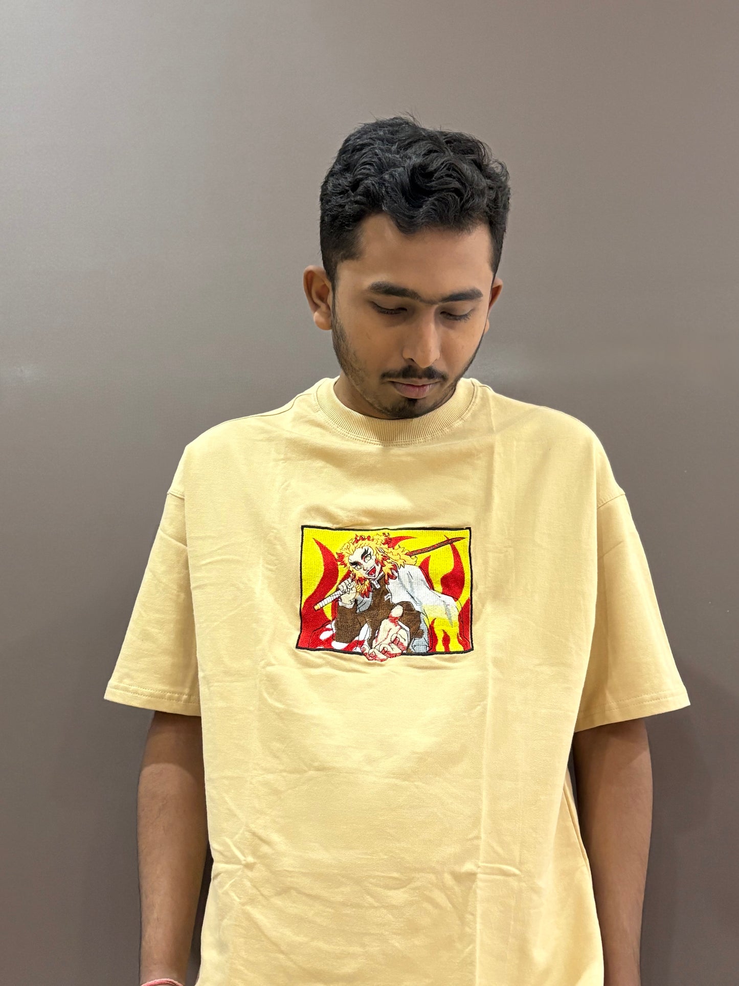 Beige oversized t-shirt with premium Demon Slayer Kyojuro Rengoku embroidery – Drip Saga anime fashion