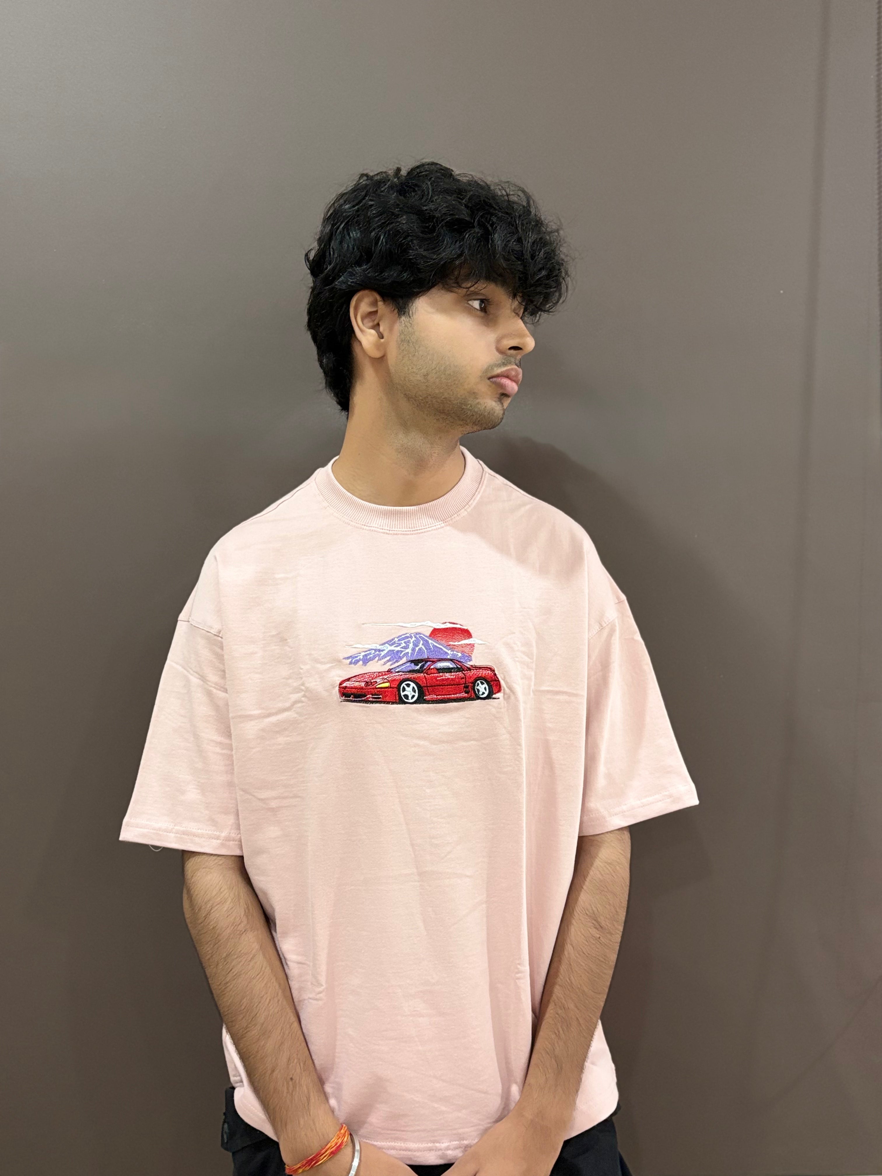 Light pink oversized t-shirt with red car embroidery – Drip Saga streetwear.