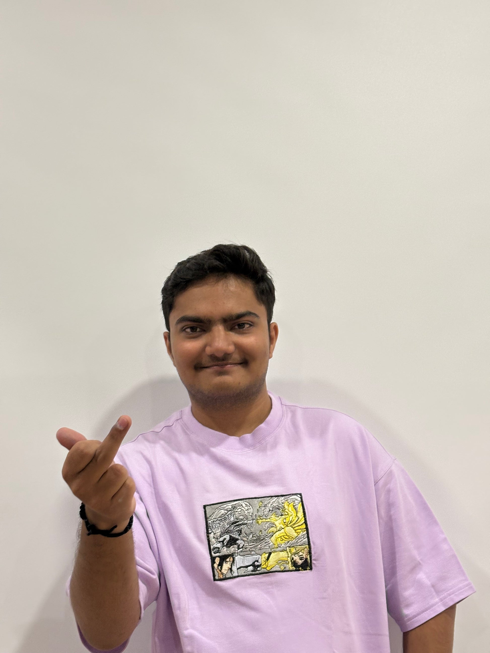 Lavender oversized t-shirt with premium Naruto vs Sasuke embroidery – Drip Saga anime streetwear.